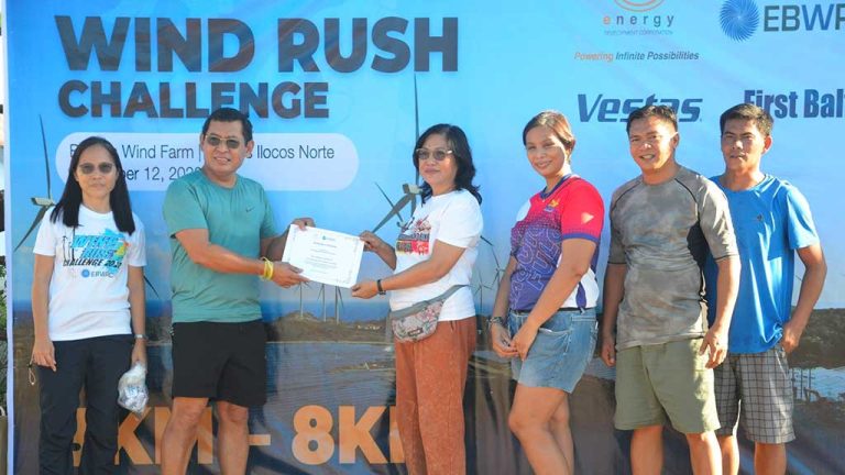 energy development corporation represenatives pose at the fun run finish